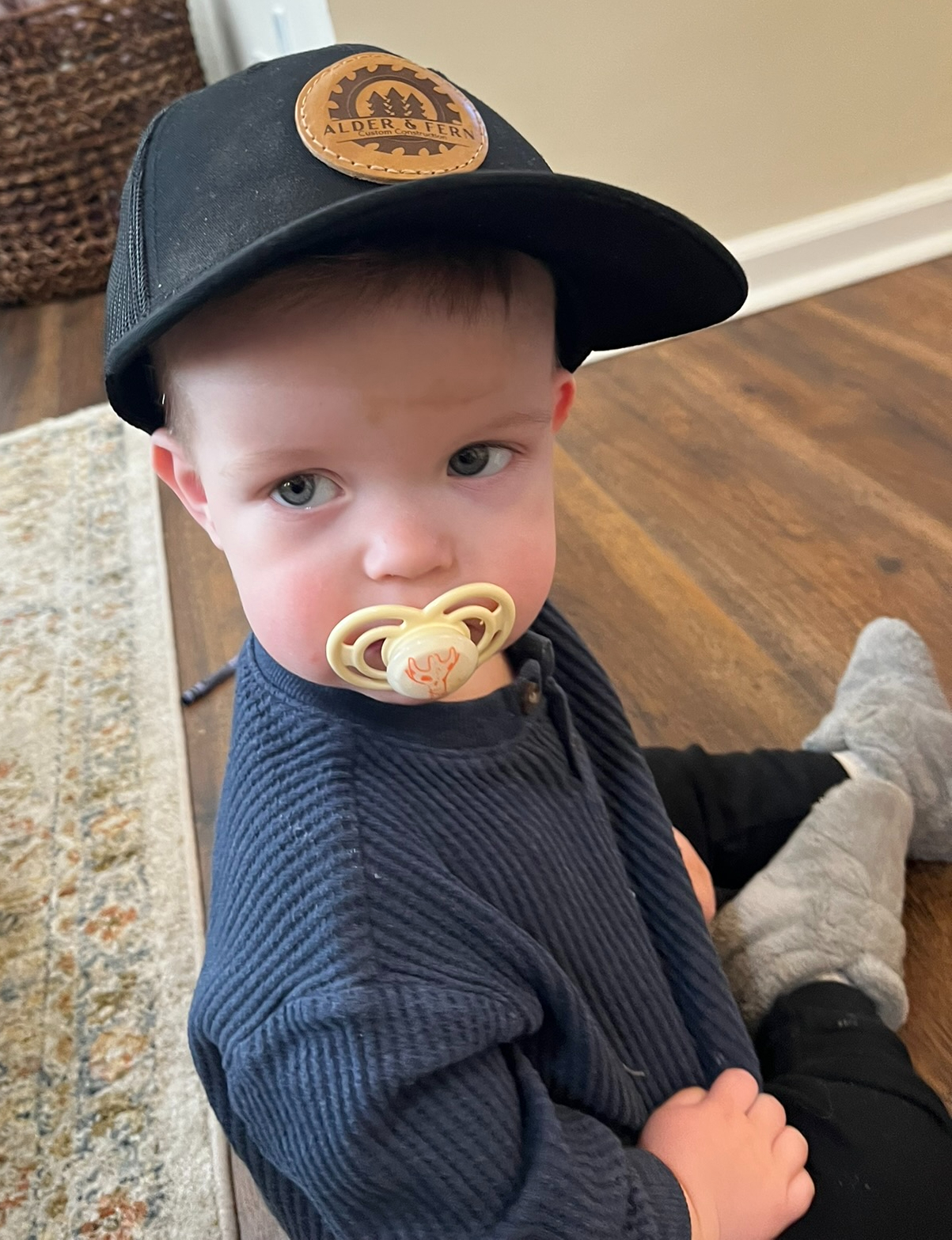 Alder wearing company hat